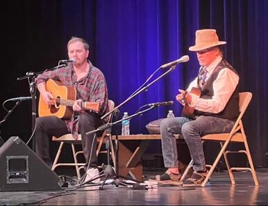 Tommy Prine (left) and Keith Sykes perform at John Prine Tribute concert in Mountain View, Ark. 